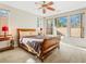 Spacious bedroom with wooden sleigh bed and ample natural light at 5625 Galivan Vista St, North Las Vegas, NV 89081