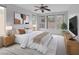 Stylishly furnished bedroom with a king bed, ample natural light, and modern decor at 5625 Galivan Vista St, North Las Vegas, NV 89081