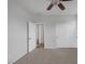 A bedroom with carpeted floors, a ceiling fan, and a closet with sliding doors at 5625 Galivan Vista St, North Las Vegas, NV 89081