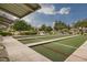 Outdoor bocce ball court featuring lush landscaping and neighborhood scenery at 5625 Galivan Vista St, North Las Vegas, NV 89081