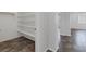 Spacious walk-in closet featuring built-in shelving for optimal storage and organization at 5625 Galivan Vista St, North Las Vegas, NV 89081