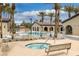 Enjoy the community pool and spa with palm trees, lounge chairs, and seating areas at 5625 Galivan Vista St, North Las Vegas, NV 89081