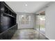 Dining area with built-in cabinetry, large windows, and a sliding glass door to the backyard at 5625 Galivan Vista St, North Las Vegas, NV 89081