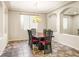 Bright dining room with chandelier and seating for six at 5625 Galivan Vista St, North Las Vegas, NV 89081