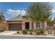 Charming single-story home with desert landscaping and a tiled roof at 5625 Galivan Vista St, North Las Vegas, NV 89081