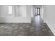 Spacious hallway with modern tile flooring and archways leading to other rooms at 5625 Galivan Vista St, North Las Vegas, NV 89081