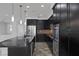 Kitchen featuring dark cabinets, granite countertops, and stainless steel appliances at 5625 Galivan Vista St, North Las Vegas, NV 89081
