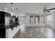 Modern open-concept kitchen and living area with recessed lighting at 5625 Galivan Vista St, North Las Vegas, NV 89081