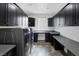 Well-organized laundry room boasts ample counter space and modern washer/dryer at 5625 Galivan Vista St, North Las Vegas, NV 89081