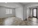 Bright living room featuring tile floors, recessed lighting, and a large window at 5625 Galivan Vista St, North Las Vegas, NV 89081