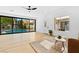 Bright living room with sliding glass doors opening to a pool and backyard at 5637 San Florentine Ave, Las Vegas, NV 89141