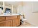 Clean bathroom with wood cabinets and a large mirror at 6250 Pale Pavilion Ave, Las Vegas, NV 89139