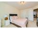 Comfortable bedroom with queen bed and access to hallway at 6250 Pale Pavilion Ave, Las Vegas, NV 89139
