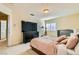 Spacious bedroom with large TV, dresser, and queen bed at 6250 Pale Pavilion Ave, Las Vegas, NV 89139