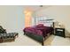Elegant bedroom with a large bed and sitting area at 6250 Pale Pavilion Ave, Las Vegas, NV 89139
