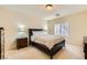 Well-lit bedroom with queen bed and double dresser at 6250 Pale Pavilion Ave, Las Vegas, NV 89139