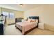 Bright bedroom with a queen bed, nightstands, and large window at 6250 Pale Pavilion Ave, Las Vegas, NV 89139