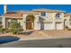 Two-story house with a brick driveway and a three-car garage at 6250 Pale Pavilion Ave, Las Vegas, NV 89139