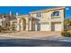 Two-story house with a brick driveway and a three-car garage at 6250 Pale Pavilion Ave, Las Vegas, NV 89139