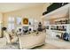 Open living room with high ceilings and a view to the dining area at 6250 Pale Pavilion Ave, Las Vegas, NV 89139