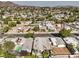Aerial view showcasing a home's location, neighborhood, and a swimming pool in the backyard at 635 8Th St, Boulder City, NV 89005