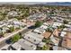 Aerial view of a house and surrounding neighborhood, showcasing the property's location and proximity to other homes at 635 8Th St, Boulder City, NV 89005