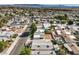 Aerial view of a house and surrounding neighborhood, showcasing the property's location and proximity to other homes at 635 8Th St, Boulder City, NV 89005