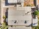 Overhead view of a home's roof, backyard patio, and surrounding landscape at 635 8Th St, Boulder City, NV 89005