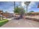 Landscaped backyard with pond, seating area, and lush greenery at 635 8Th St, Boulder City, NV 89005