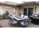 Backyard patio with dining area and grill at 635 8Th St, Boulder City, NV 89005
