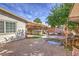Spacious backyard oasis with hot tub, pond, and seating area at 635 8Th St, Boulder City, NV 89005
