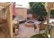 Relaxing backyard patio with fire pit, seating area, and pond feature at 635 8Th St, Boulder City, NV 89005