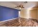 Bright bedroom with wood-look floors and ceiling fan at 635 8Th St, Boulder City, NV 89005