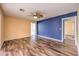 Bright bedroom with wood-look floors and ceiling fan at 635 8Th St, Boulder City, NV 89005