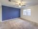 Living room with a ceiling fan and large window at 635 8Th St, Boulder City, NV 89005