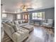 Bright living room with L-shaped sofa and wood-look floors at 635 8Th St, Boulder City, NV 89005