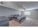 Spacious main bedroom with ceiling fan and carpet flooring at 635 8Th St, Boulder City, NV 89005