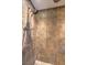 Large shower with dual shower heads and stone tile floor at 635 8Th St, Boulder City, NV 89005