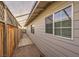 Long side yard with covered walkway and wooden fence at 635 8Th St, Boulder City, NV 89005
