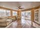 Sunroom with wood-look floors, comfy seating and backyard access at 635 8Th St, Boulder City, NV 89005