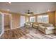 Sunroom with wood-look floors, comfy seating, and backyard access at 635 8Th St, Boulder City, NV 89005