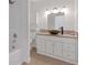 Updated bathroom features a vessel sink, modern fixtures, and bathtub at 7220 Stormson Dr, Las Vegas, NV 89145