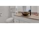 Modern bathroom with stylish vessel sink, granite countertop, and ample storage at 7220 Stormson Dr, Las Vegas, NV 89145