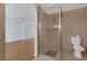 Clean bathroom with a walk-in shower and toilet at 7220 Stormson Dr, Las Vegas, NV 89145