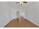 Spacious bedroom with mirrored closet and wood floors at 7220 Stormson Dr, Las Vegas, NV 89145