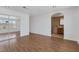 Bright bedroom with mirrored closet and wood-look floors at 7220 Stormson Dr, Las Vegas, NV 89145