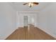 Bedroom with wood-look floors, ceiling fan, and closet at 7220 Stormson Dr, Las Vegas, NV 89145