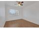 Bright bedroom with hardwood floors and a ceiling fan at 7220 Stormson Dr, Las Vegas, NV 89145