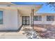 Charming front entrance with iron security gate and well-maintained walkway at 7220 Stormson Dr, Las Vegas, NV 89145