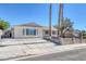 Single-story home with a fenced front yard and desert landscaping in a quiet neighborhood at 7220 Stormson Dr, Las Vegas, NV 89145